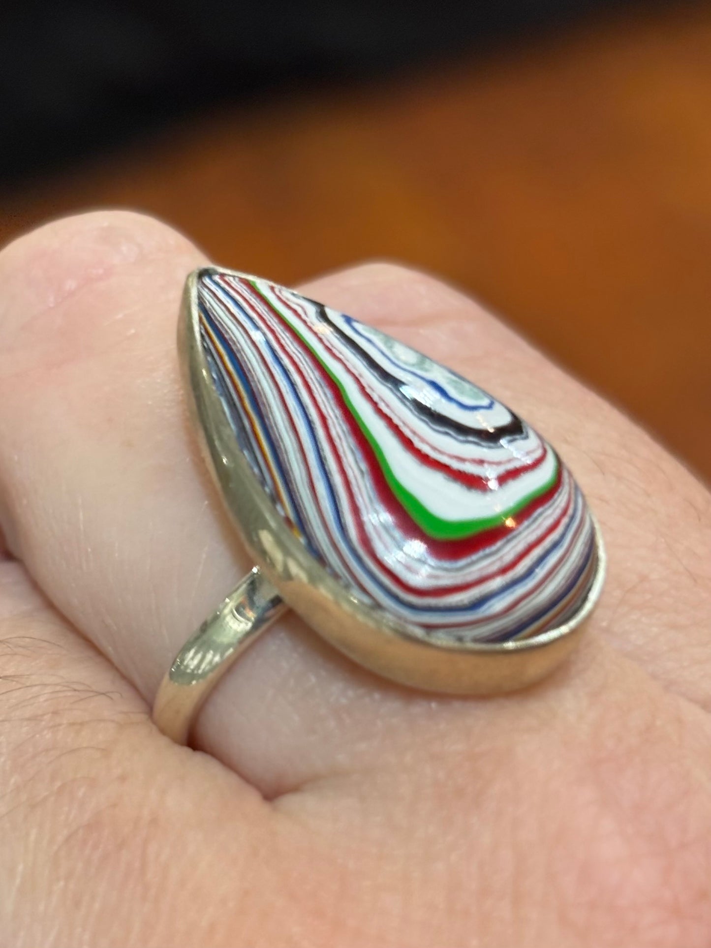 Sterling silver pear-shaped fordite cabochon ring