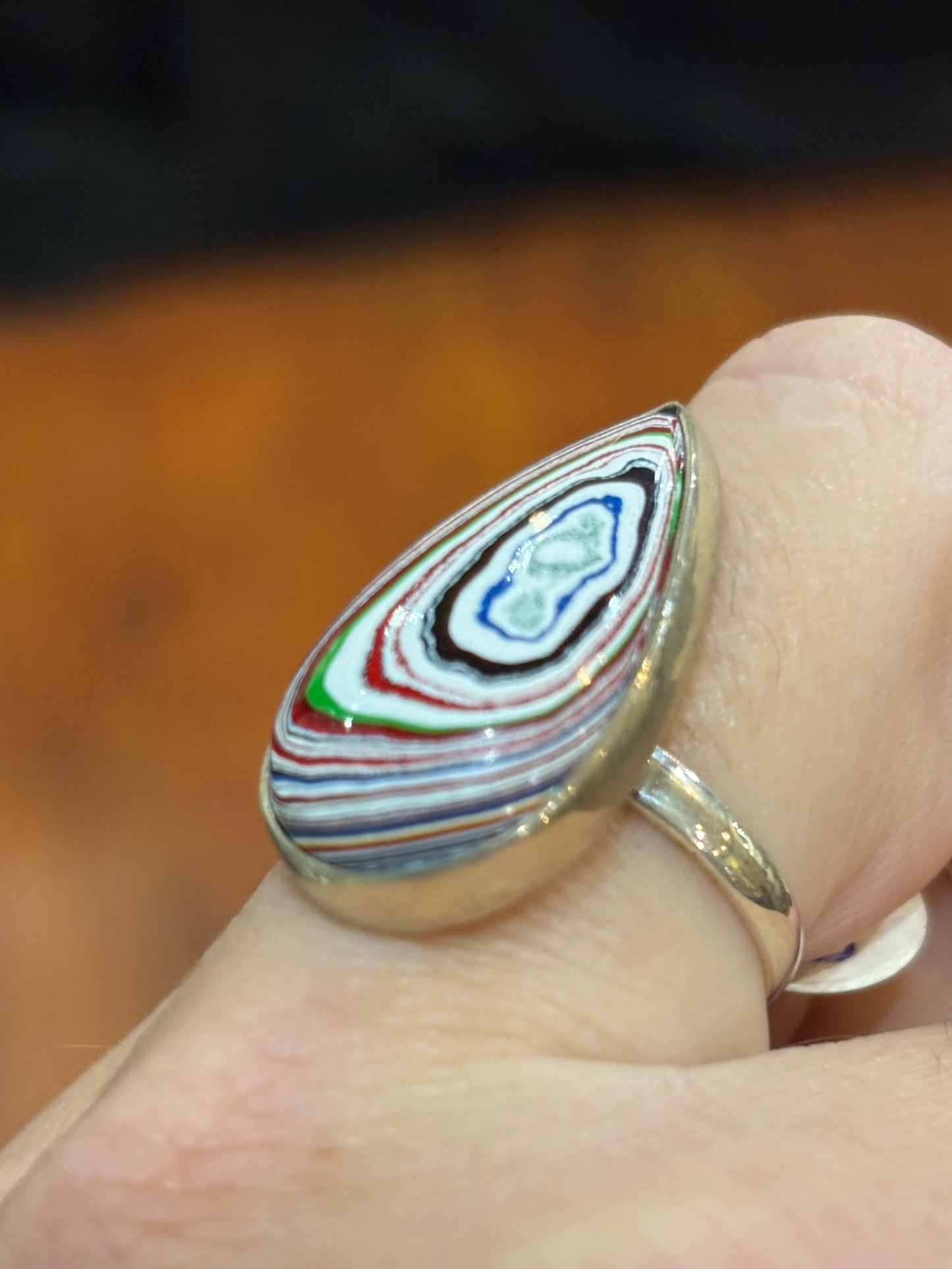Sterling silver pear-shaped fordite cabochon ring