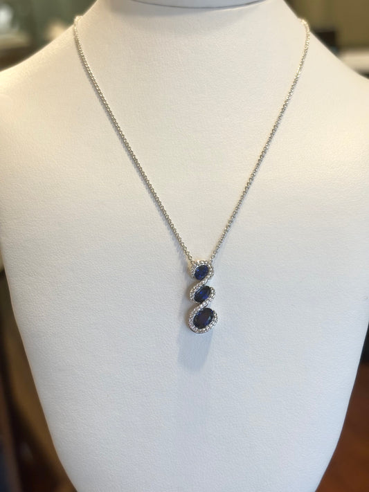 Sterling silver pendant with three blue sapphires