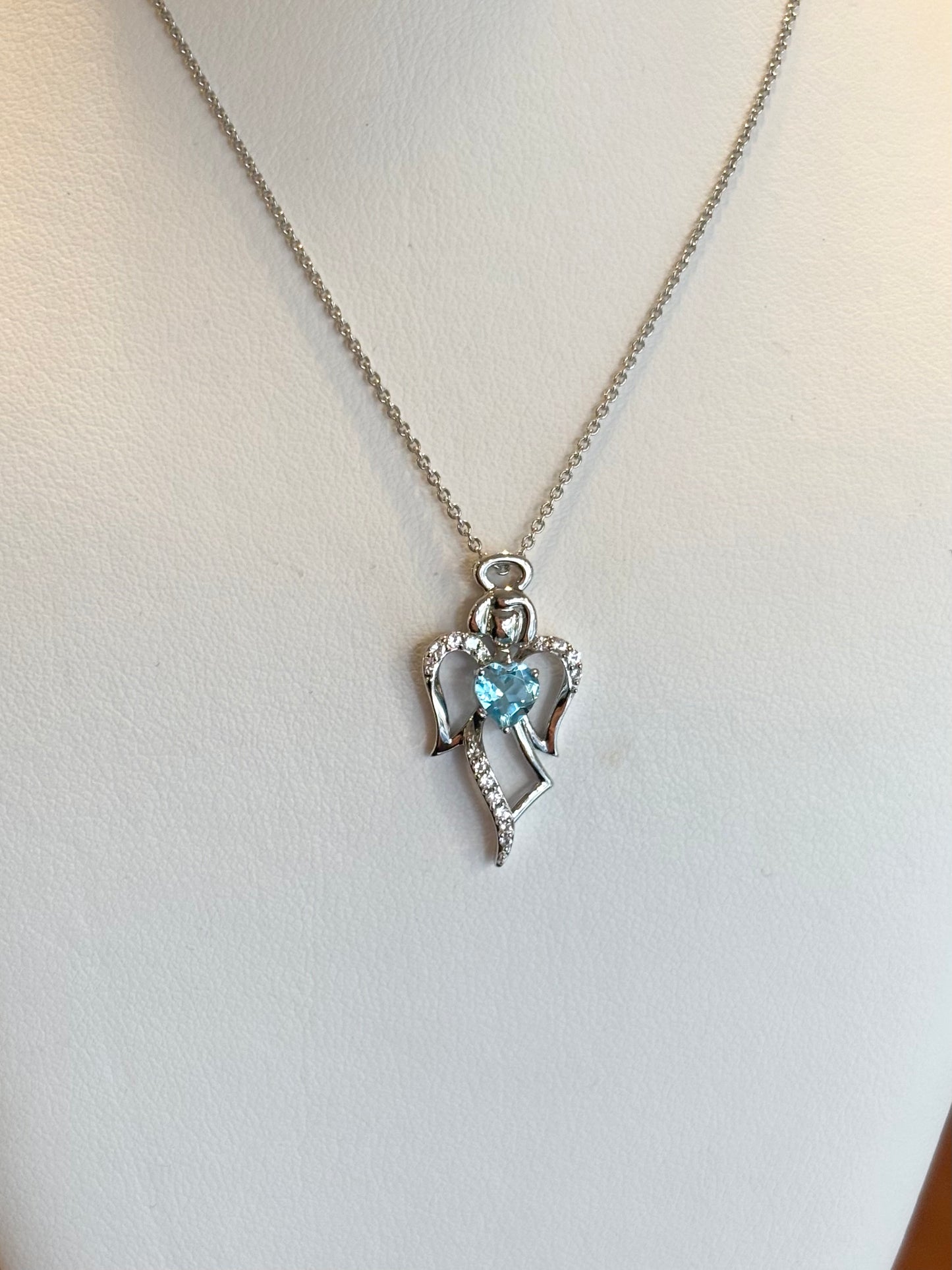 Sterling silver blue topaz heart angel pendant