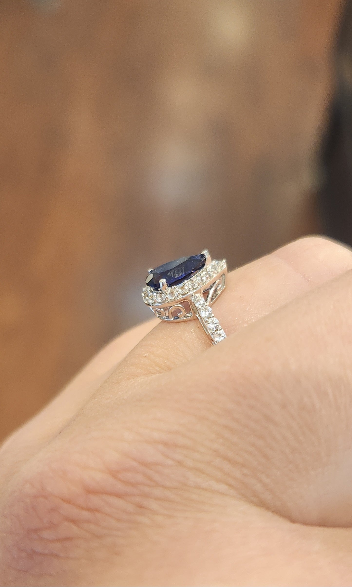 Sterling silver pear-shaped sapphire halo ring