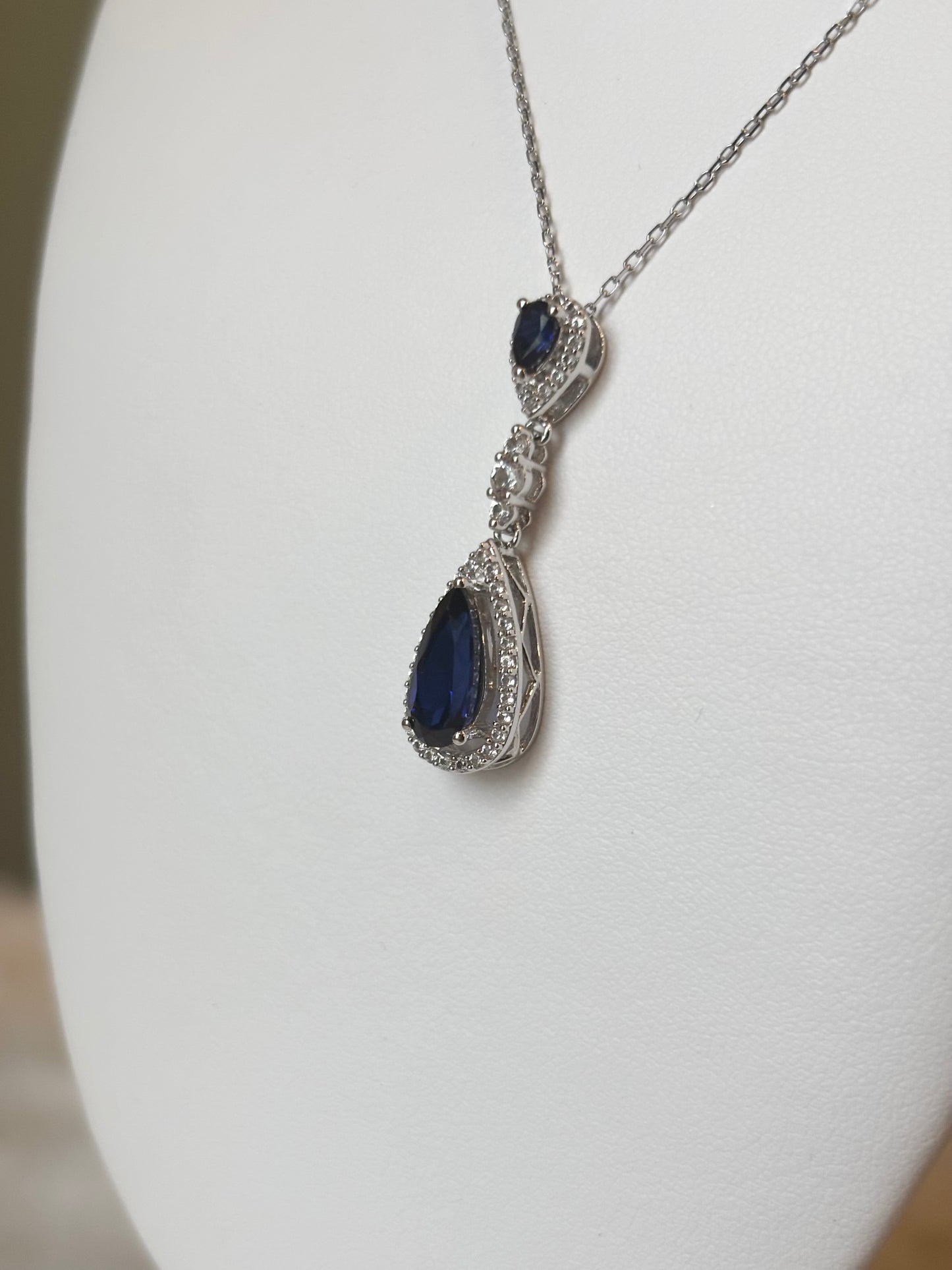 Sterling silver multi stone pear shaped blue sapphire halo pendant