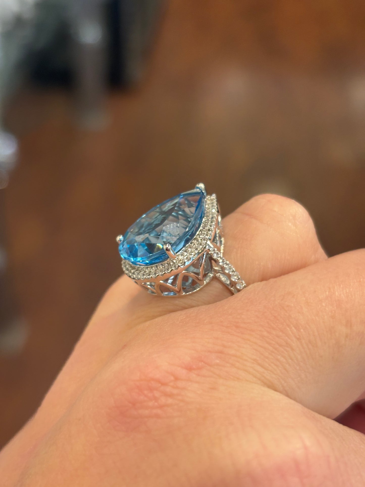 Sterling silver large pear-shaped blue topaz statement ring with diamonds