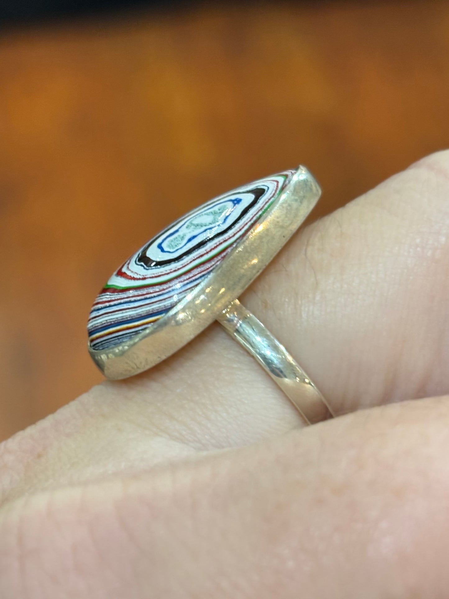 Sterling silver pear-shaped fordite cabochon ring