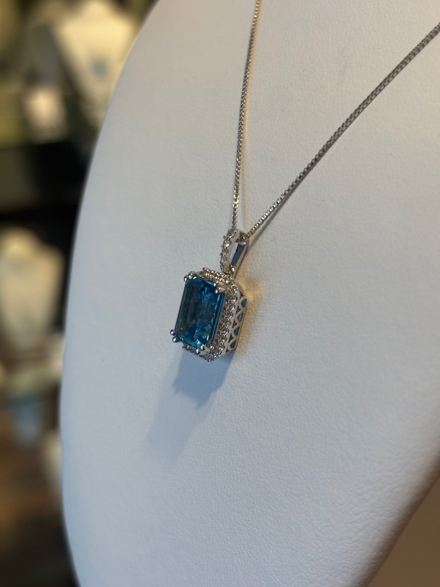 Sterling silver rectangle blue topaz pendant with diamonds