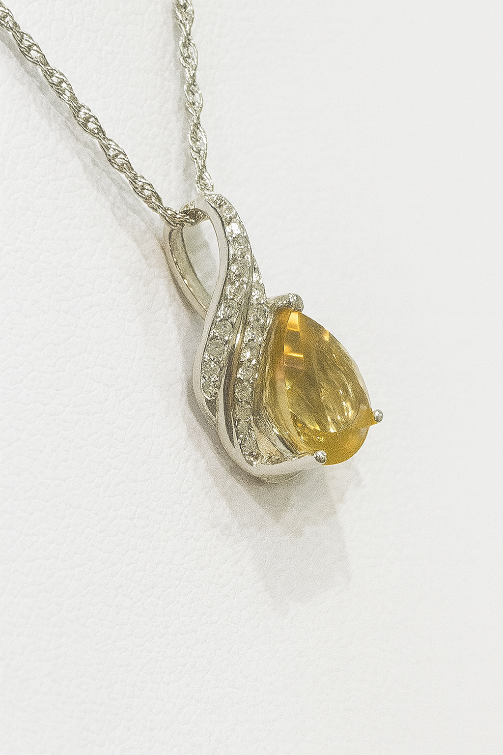 Sterling silver citrine pendant with diamonds
