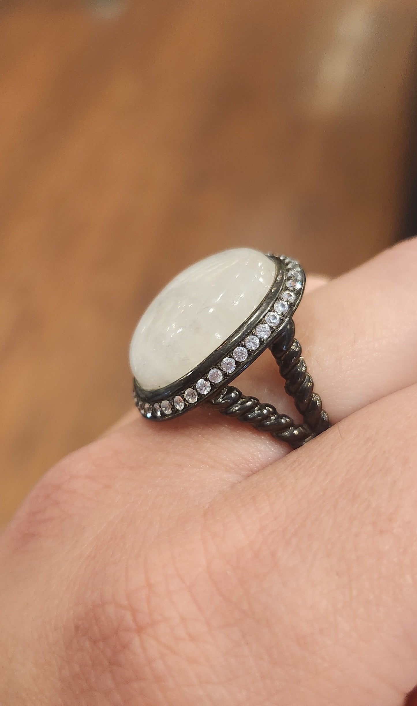 Sterling silver rainbow moonstone ring with white topaz