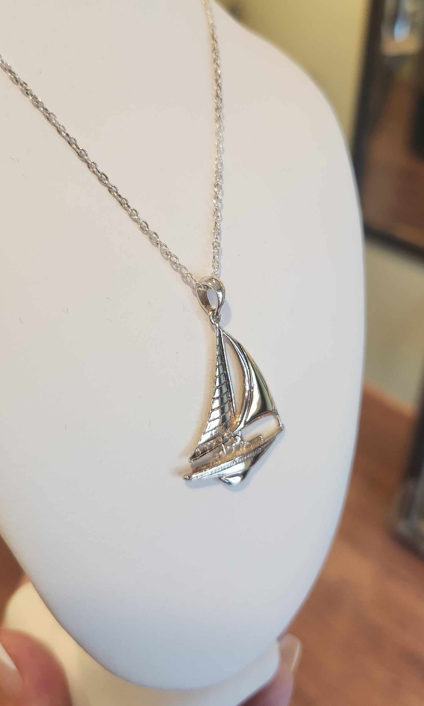 Sterling silver sailboat pendant with gold accent