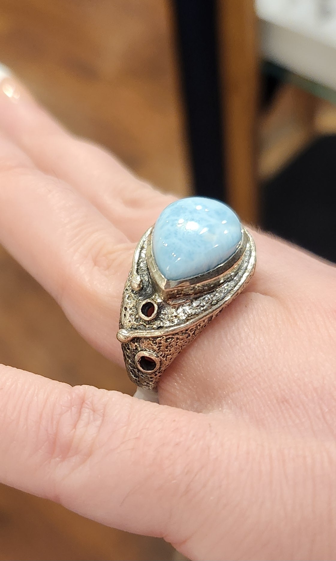 Sterling silver ring with sideways pear-shaped larimar cabochon