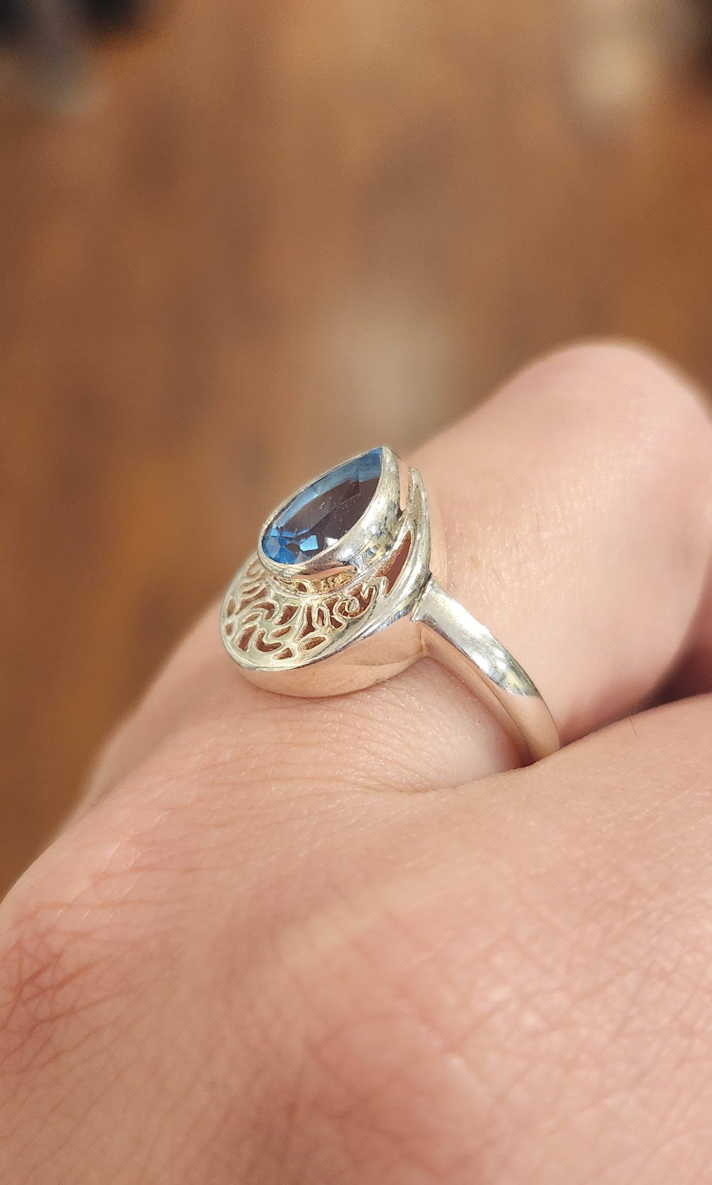 Sterling silver pear-shaped blue topaz filigree ring