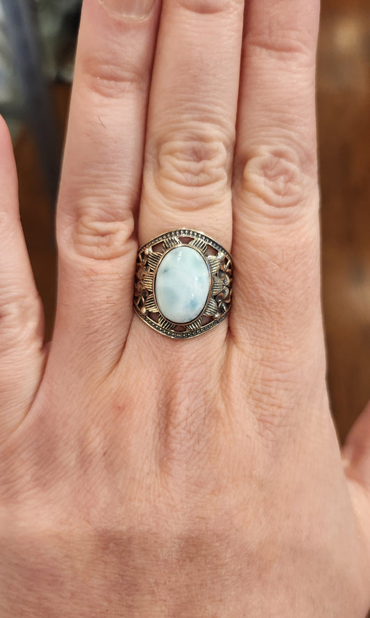 Sterling silver floral ring with oval-shaped larimar cabochon