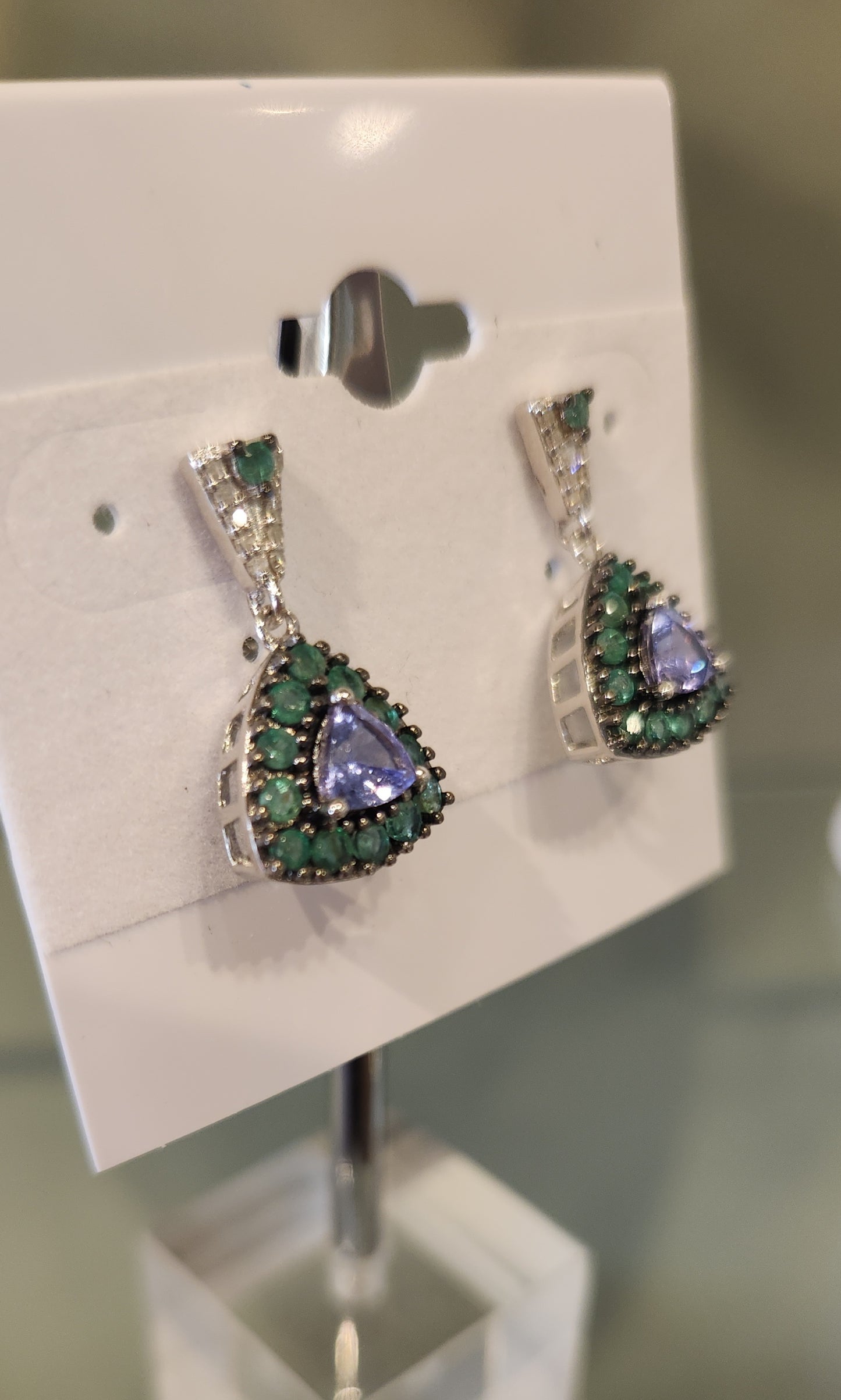 Sterling silver tanzanite dangle earrings with emeralds