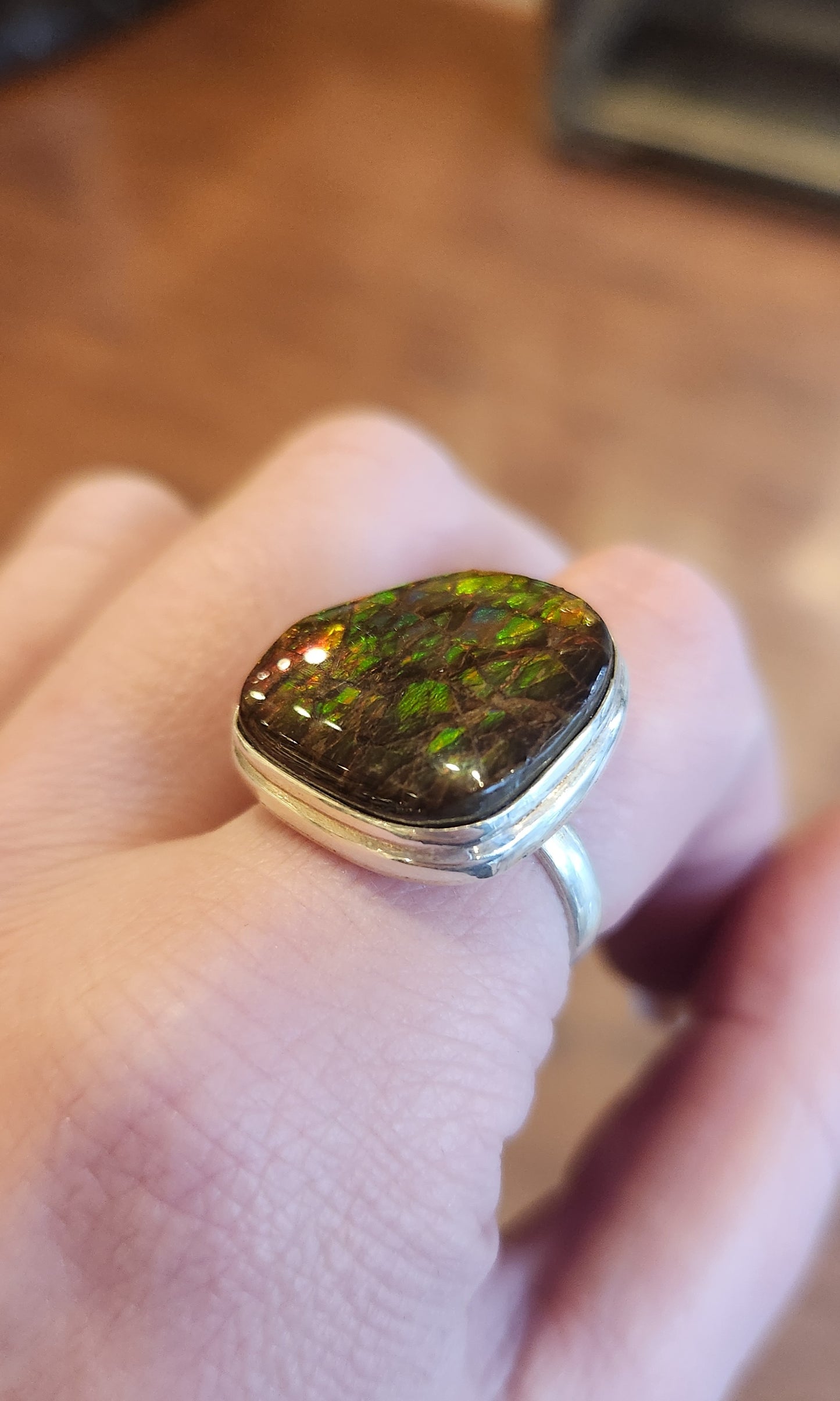 Sterling silver ammolite ring with orange/green flash