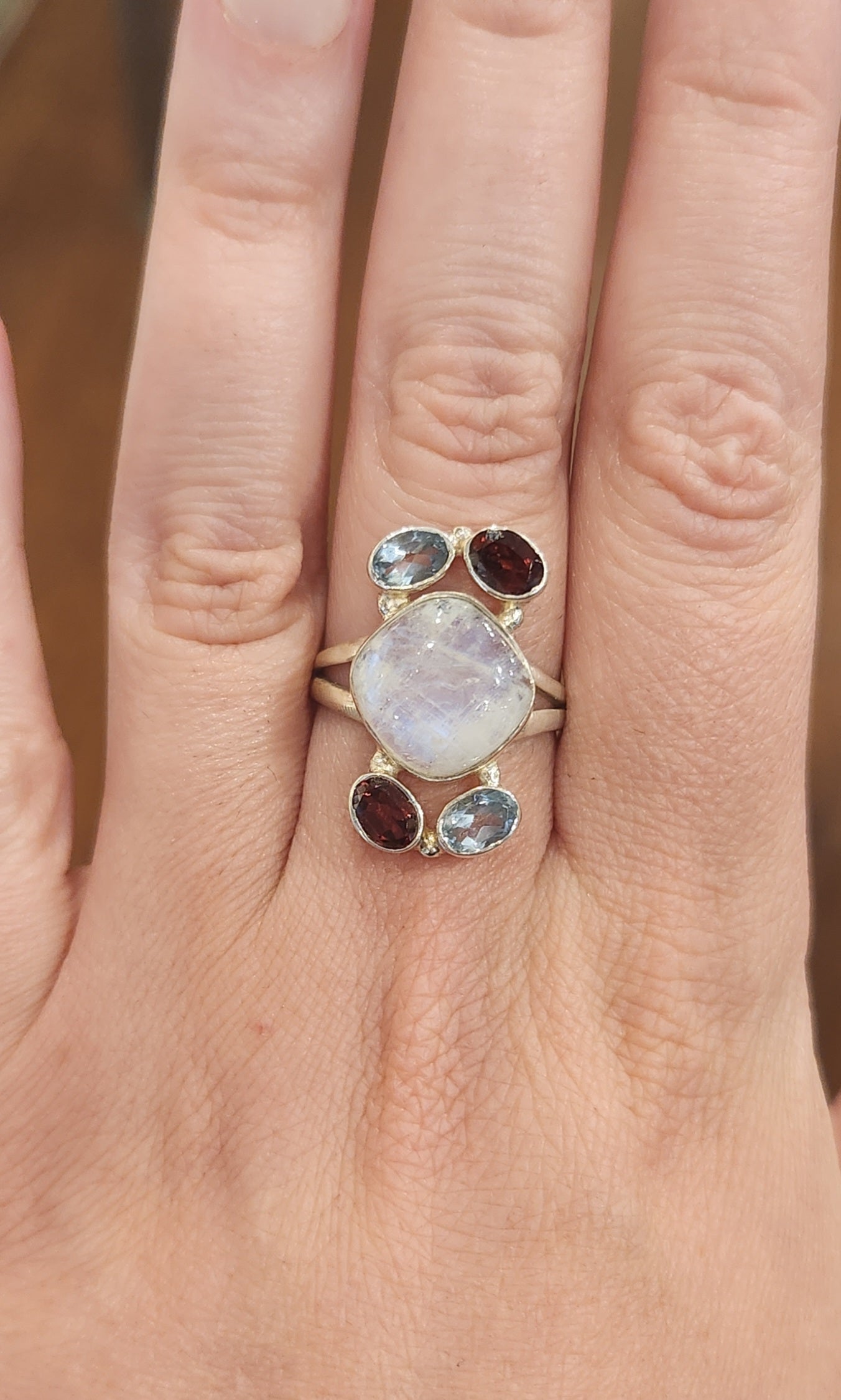 Sterling silver rainbow moonstone ring with garnet and blue topaz