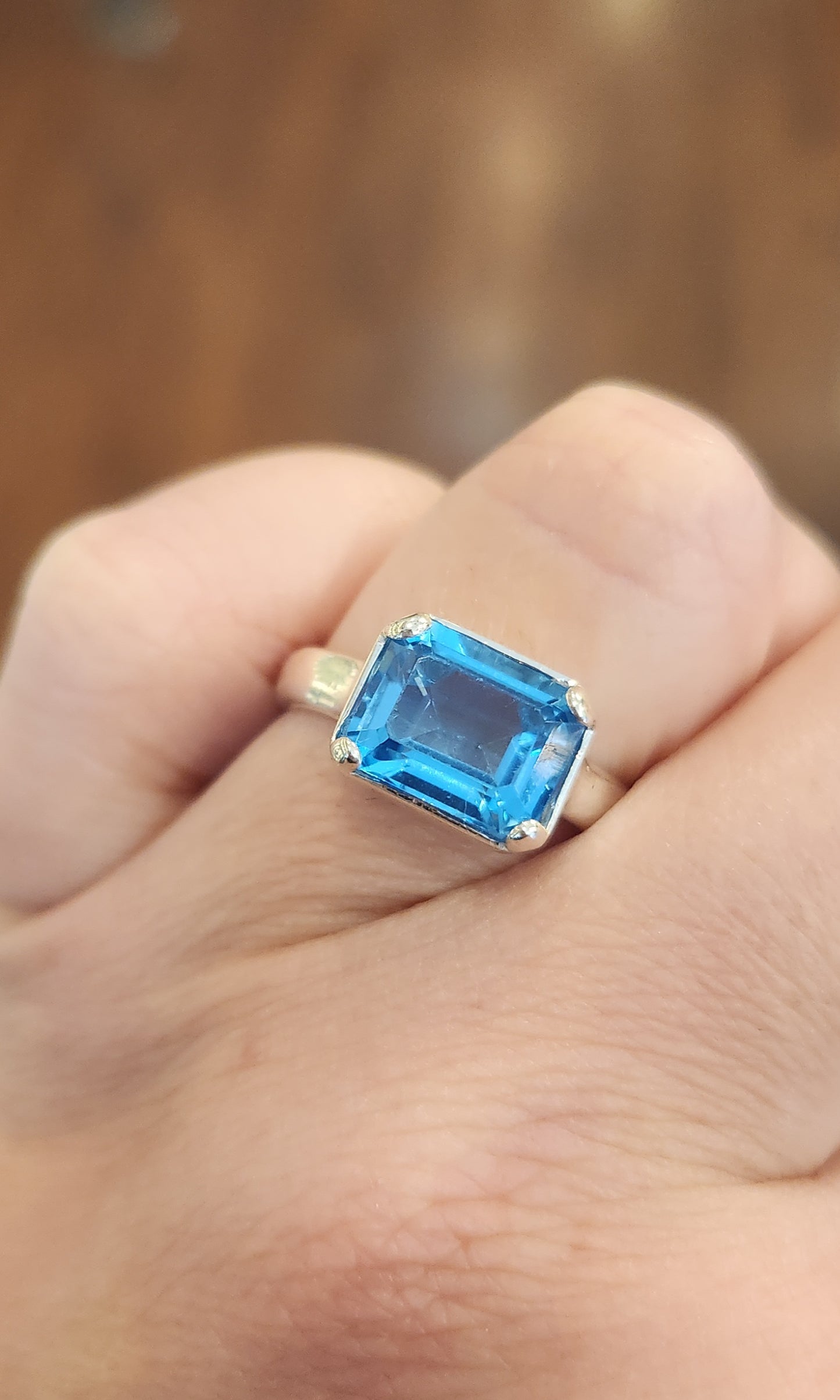 Sterling silver blue topaz bezel-prong ring