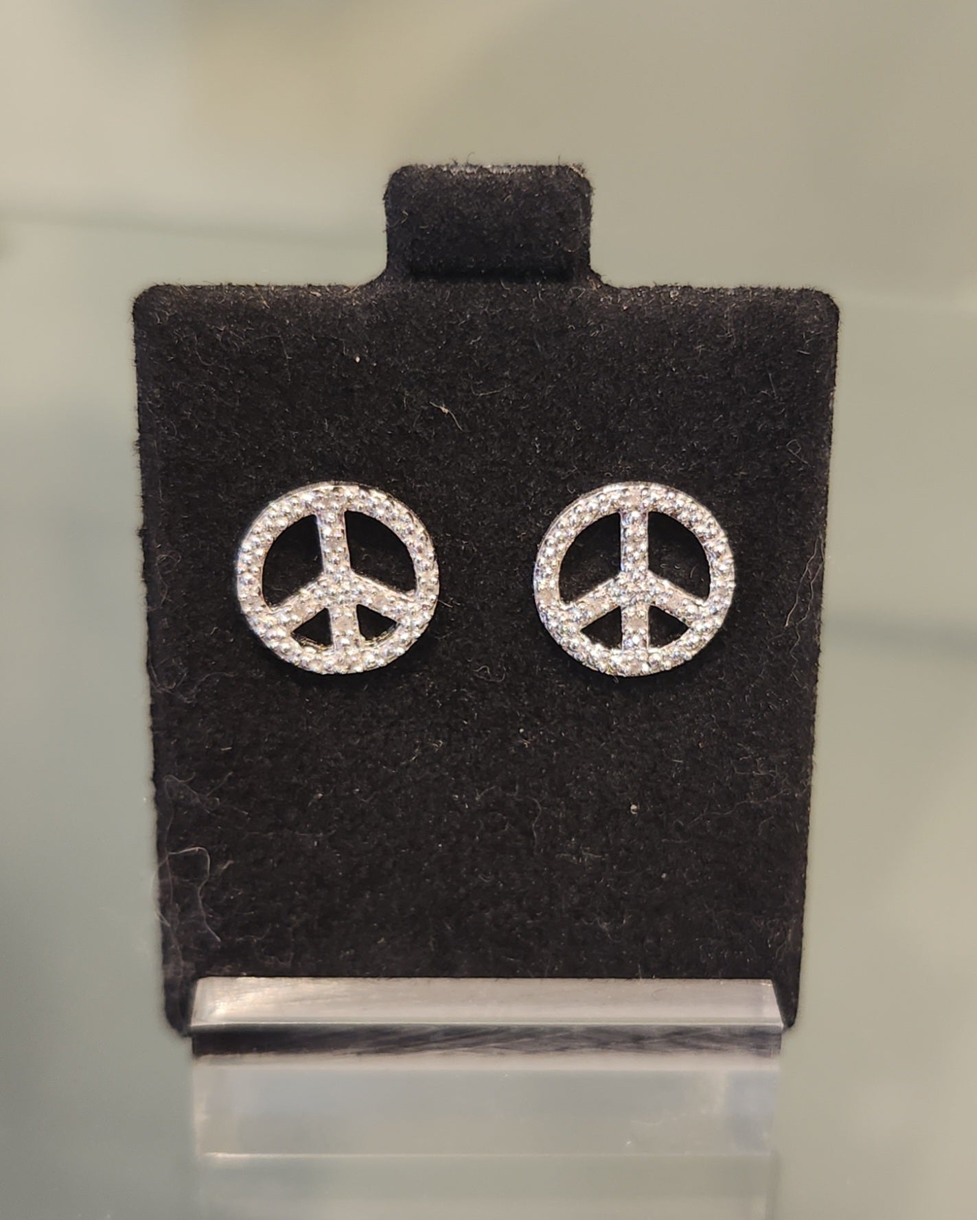 Sterling silver diamond peace sign stud earrings