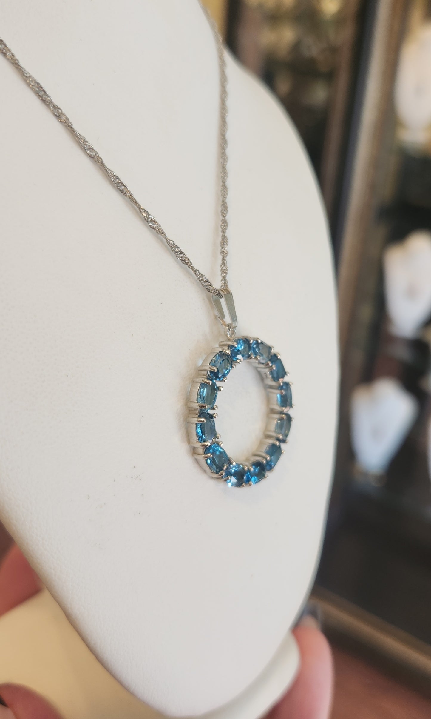 Sterling silver blue topaz circle pendant