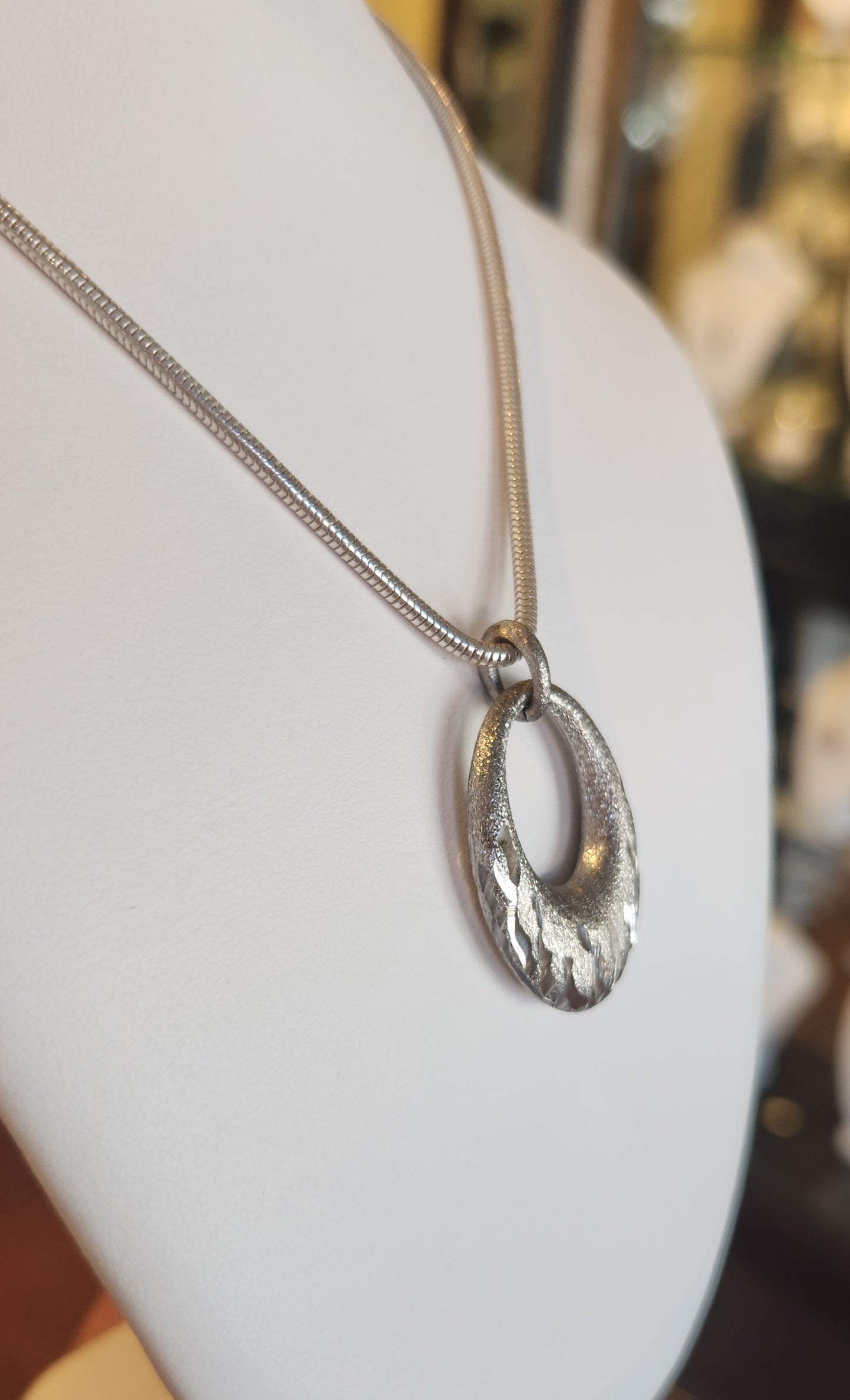 Sterling silver oval textured pendant