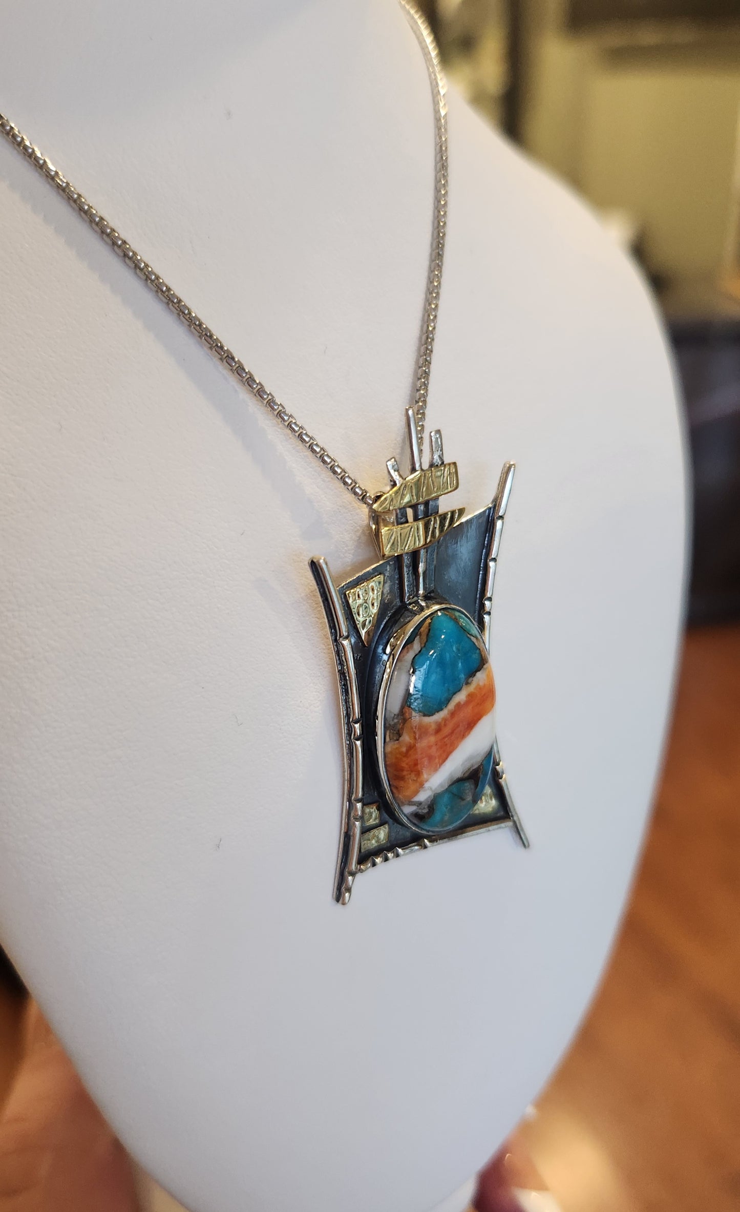 Sterling silver turquoise pendant with gold accents