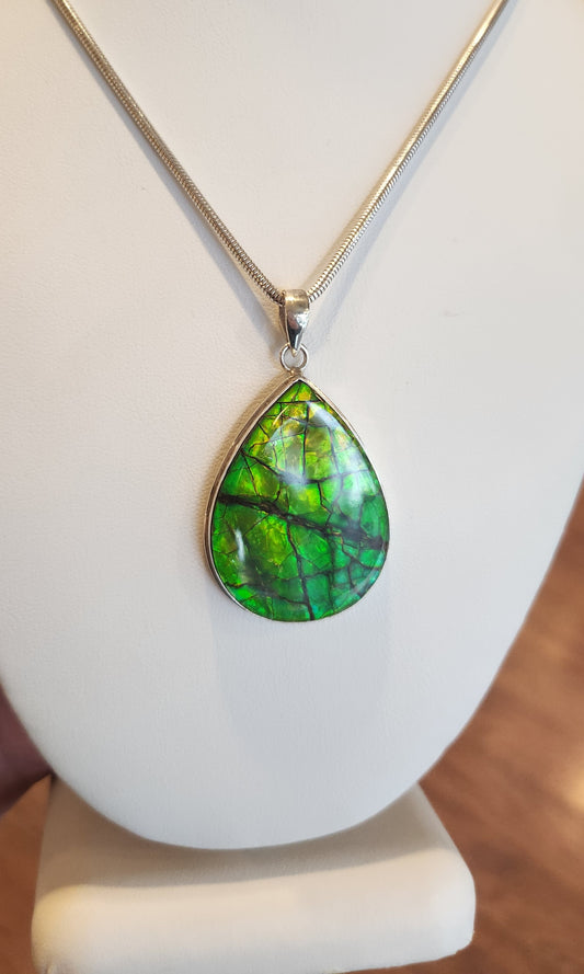 Large sterling silver ammolite pendant with green flash
