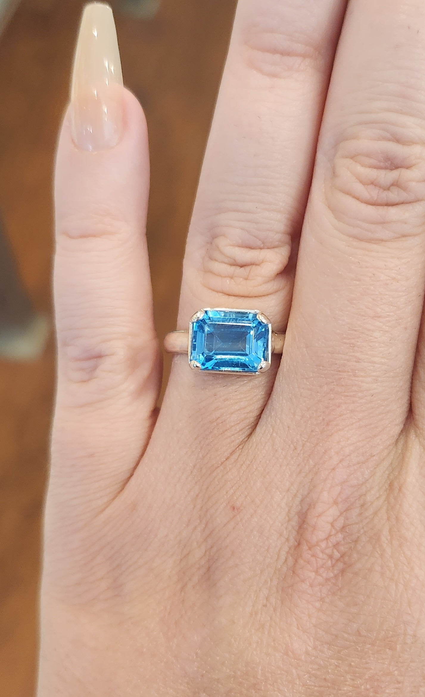 Sterling silver blue topaz bezel-prong ring