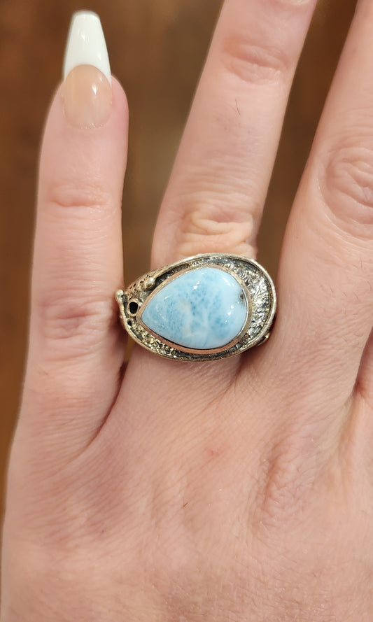 Sterling silver ring with sideways pear-shaped larimar cabochon