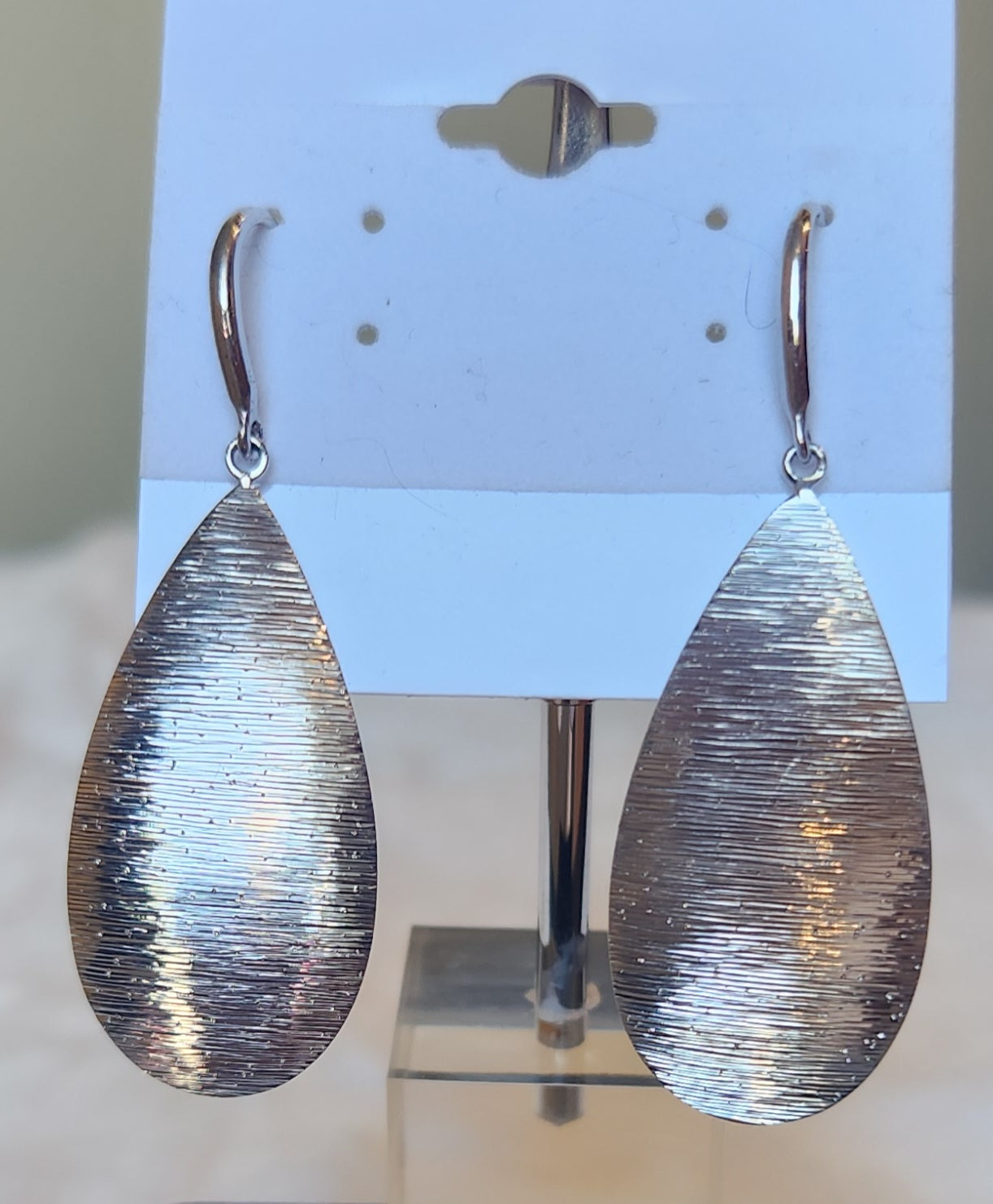 Sterling silver dangle pear-shaped textured earrings