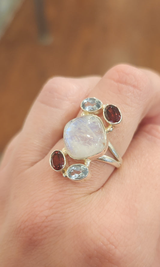 Sterling silver rainbow moonstone ring with garnet and blue topaz