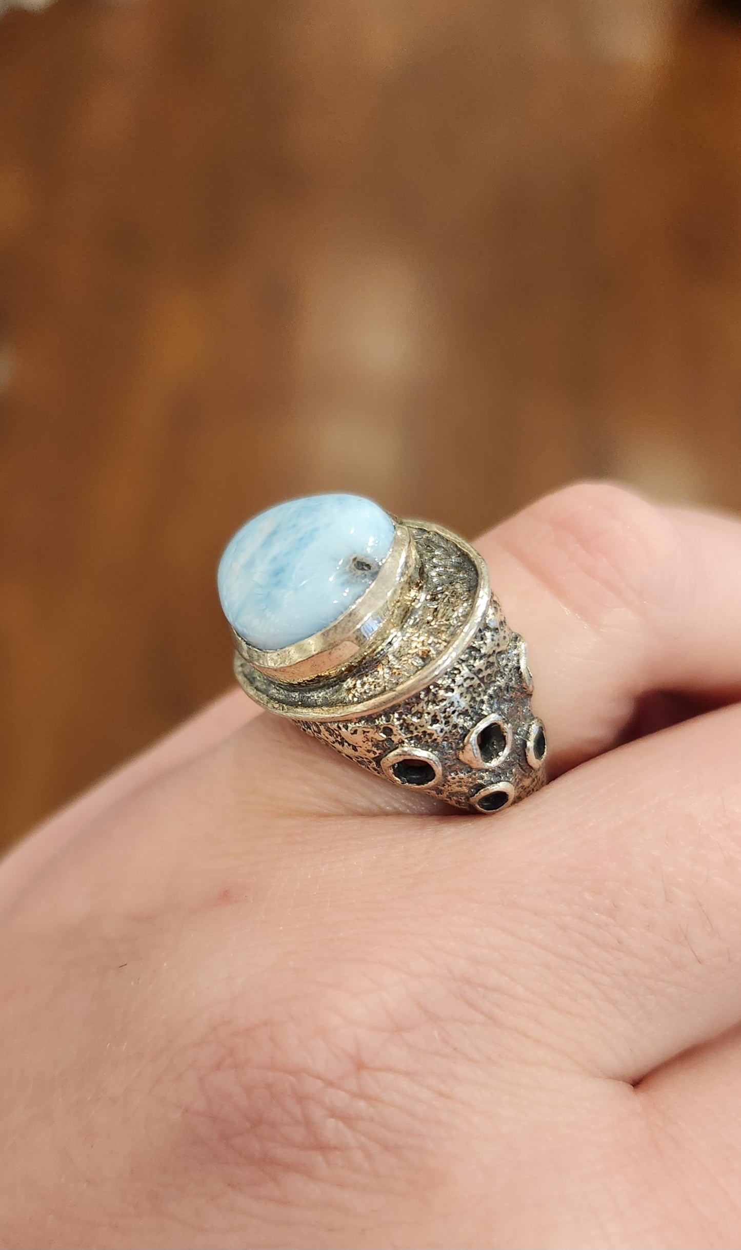 Sterling silver ring with sideways pear-shaped larimar cabochon