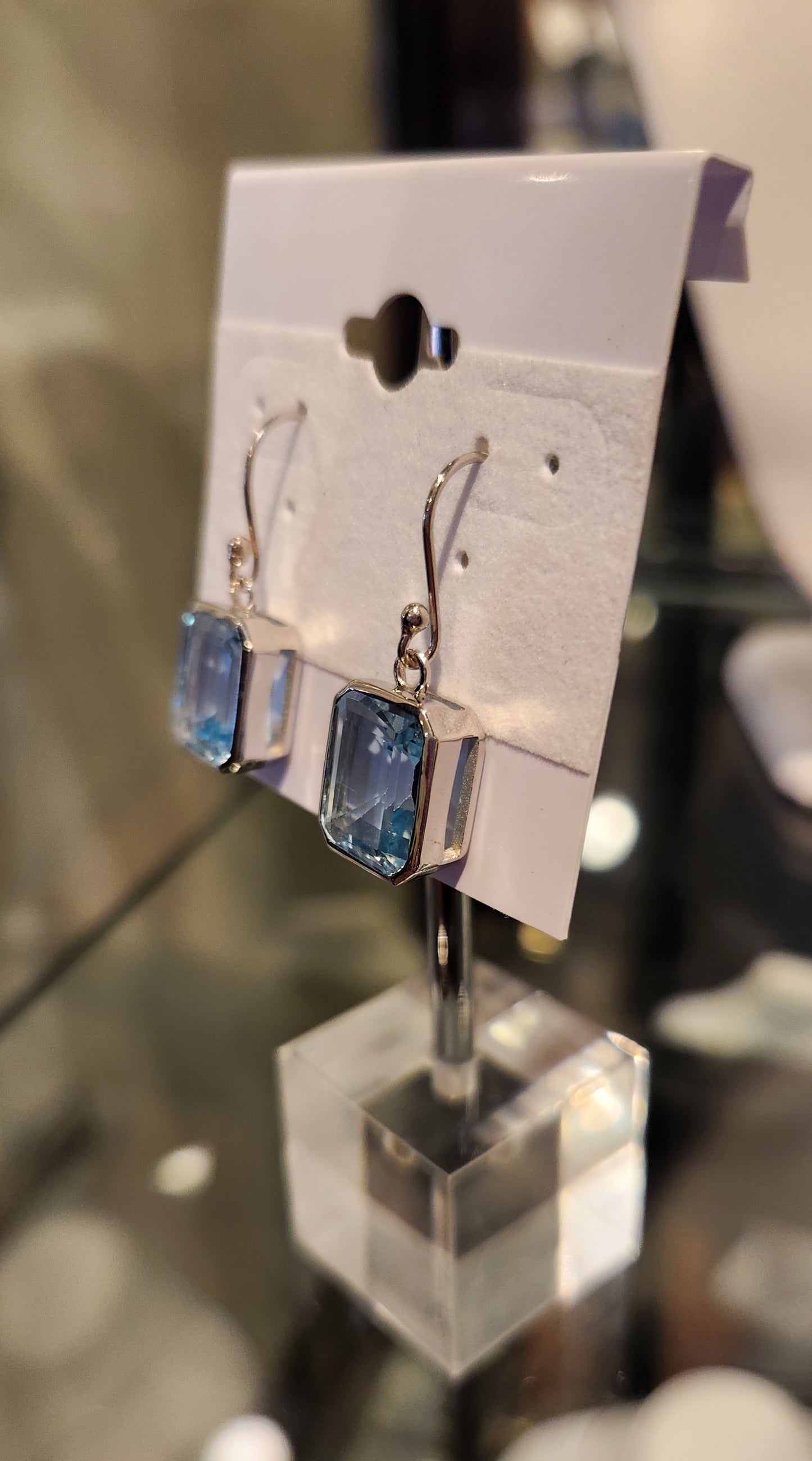 Sterling silver emerald-cut blue topaz earrings