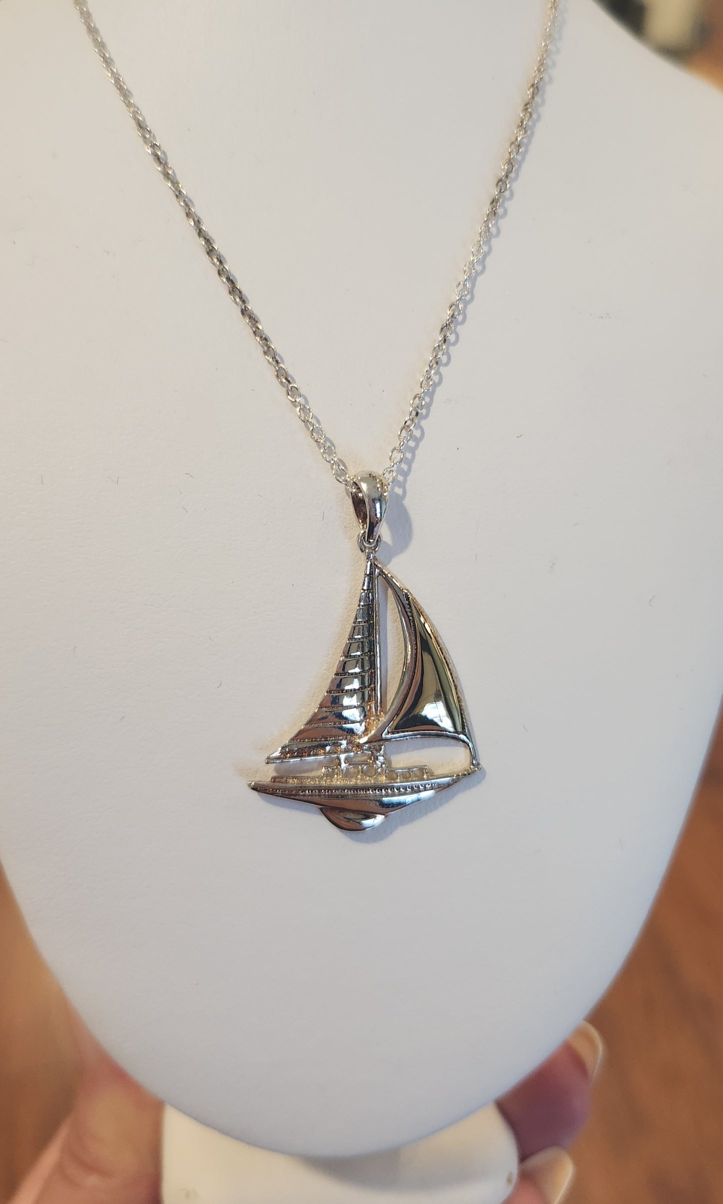 Sterling silver sailboat pendant with gold accent