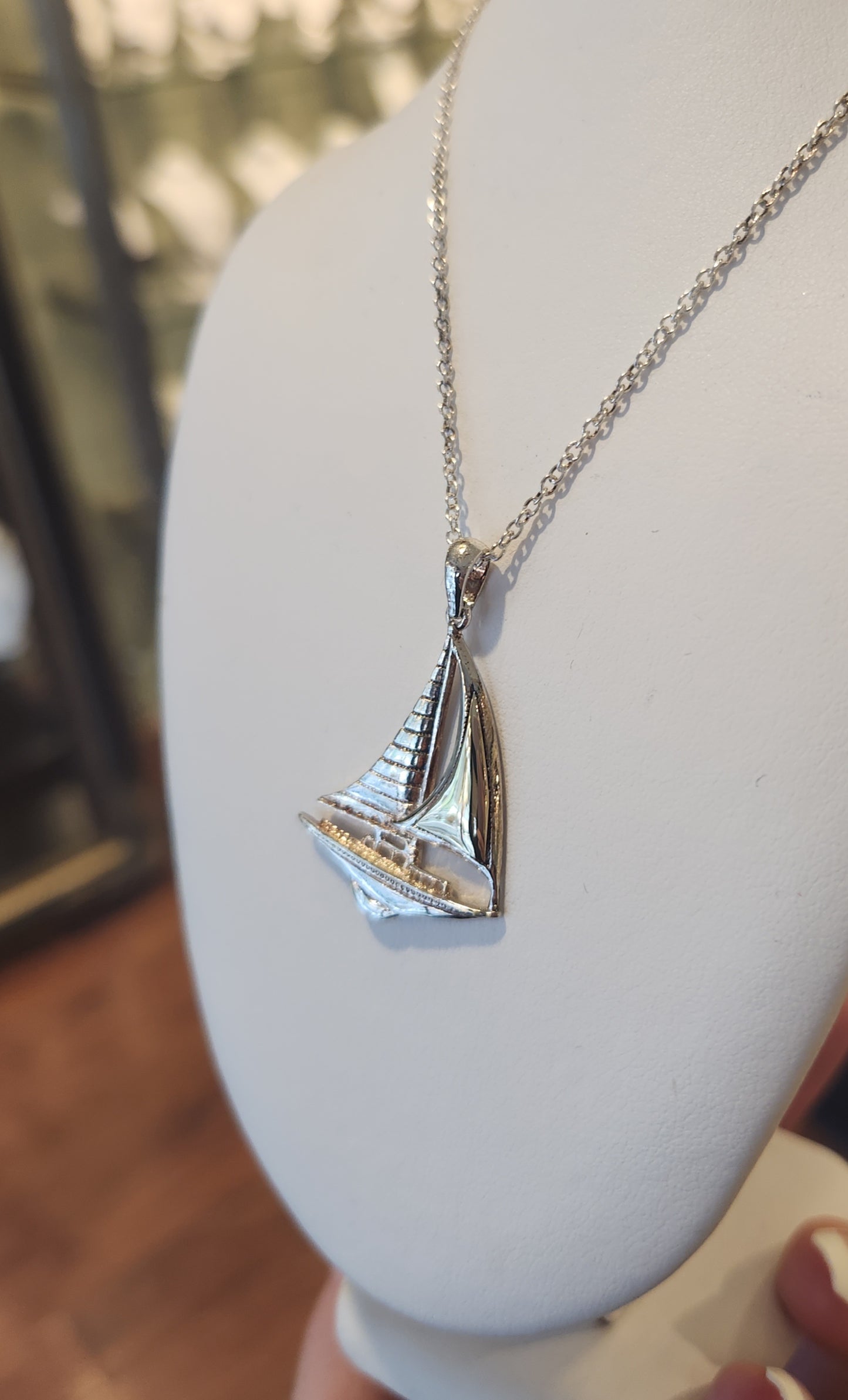 Sterling silver sailboat pendant with gold accent