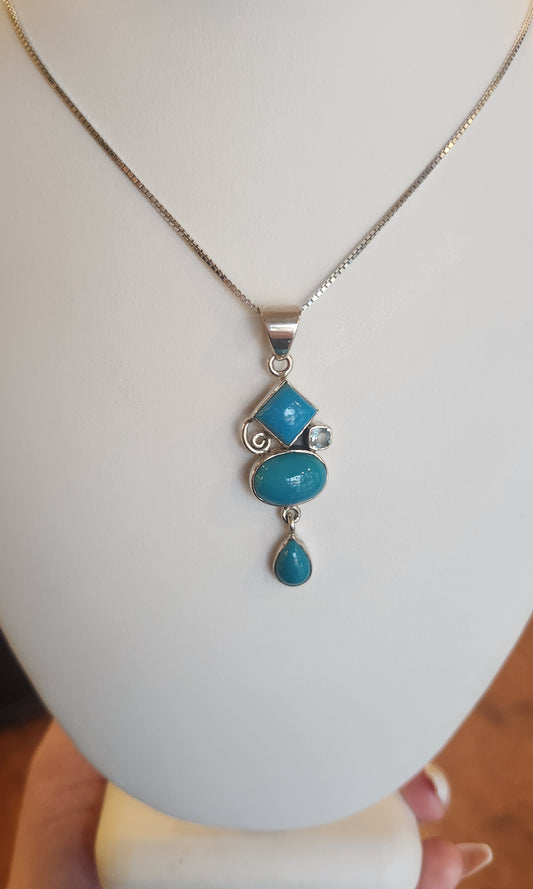 Sterling silver turquoise pendant with blue topaz