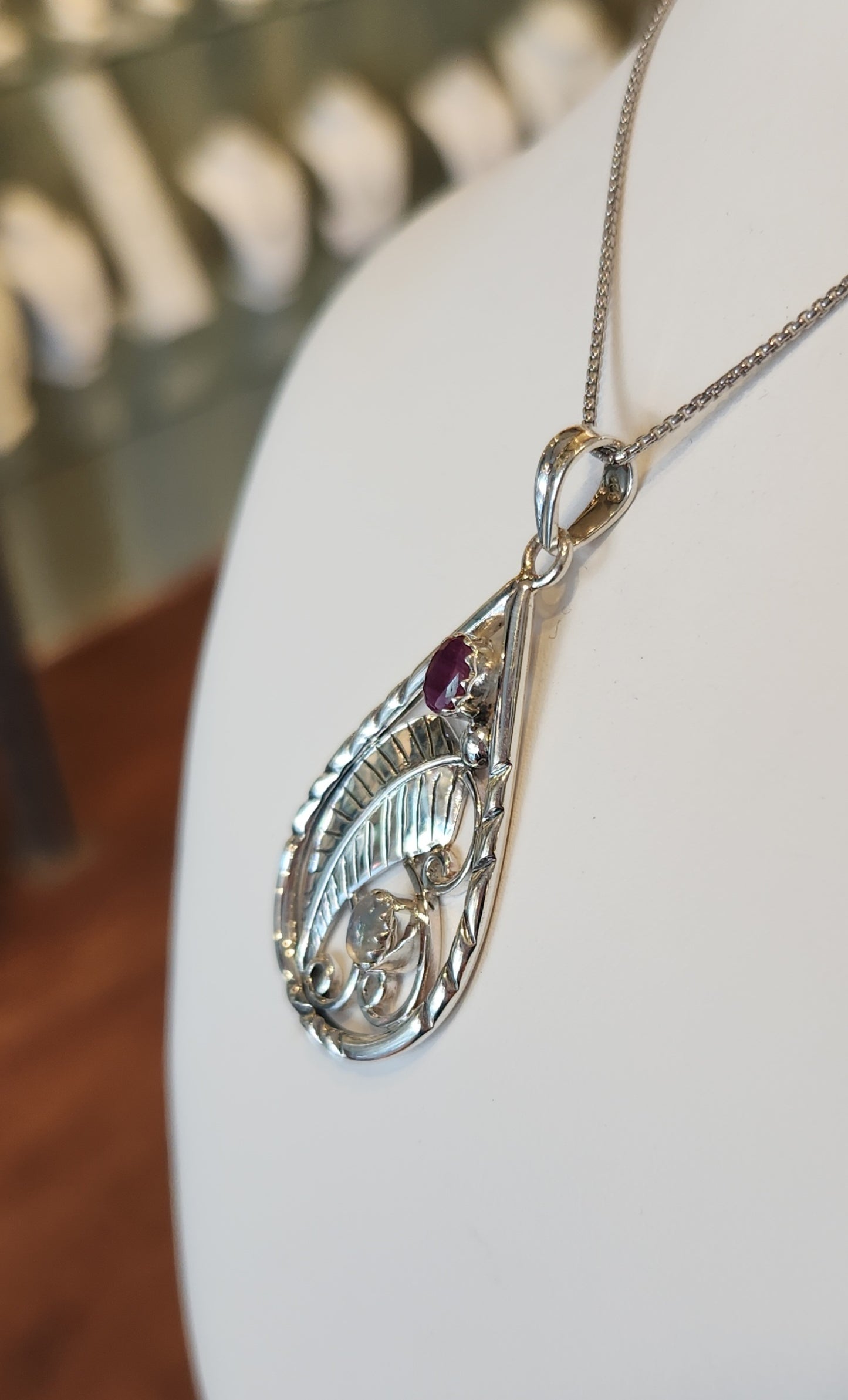 Sterling silver leaf pendant with ruby and rainbow moonstone