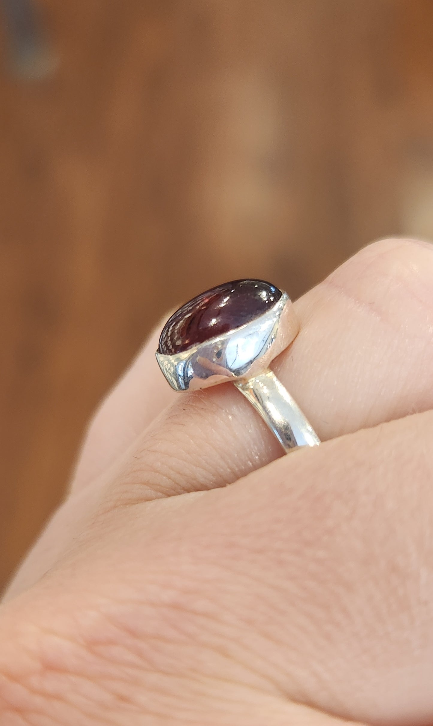 Sterling silver oval garnet bezel ring