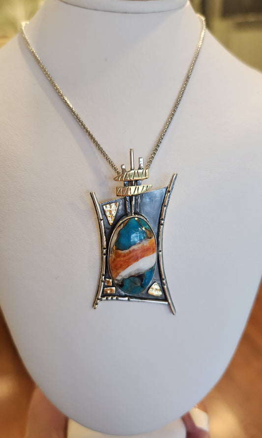 Sterling silver turquoise pendant with gold accents