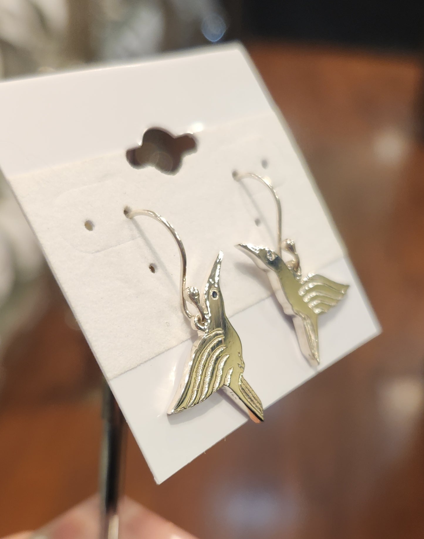 Sterling silver handmade hummingbird earrings with blue sapphires