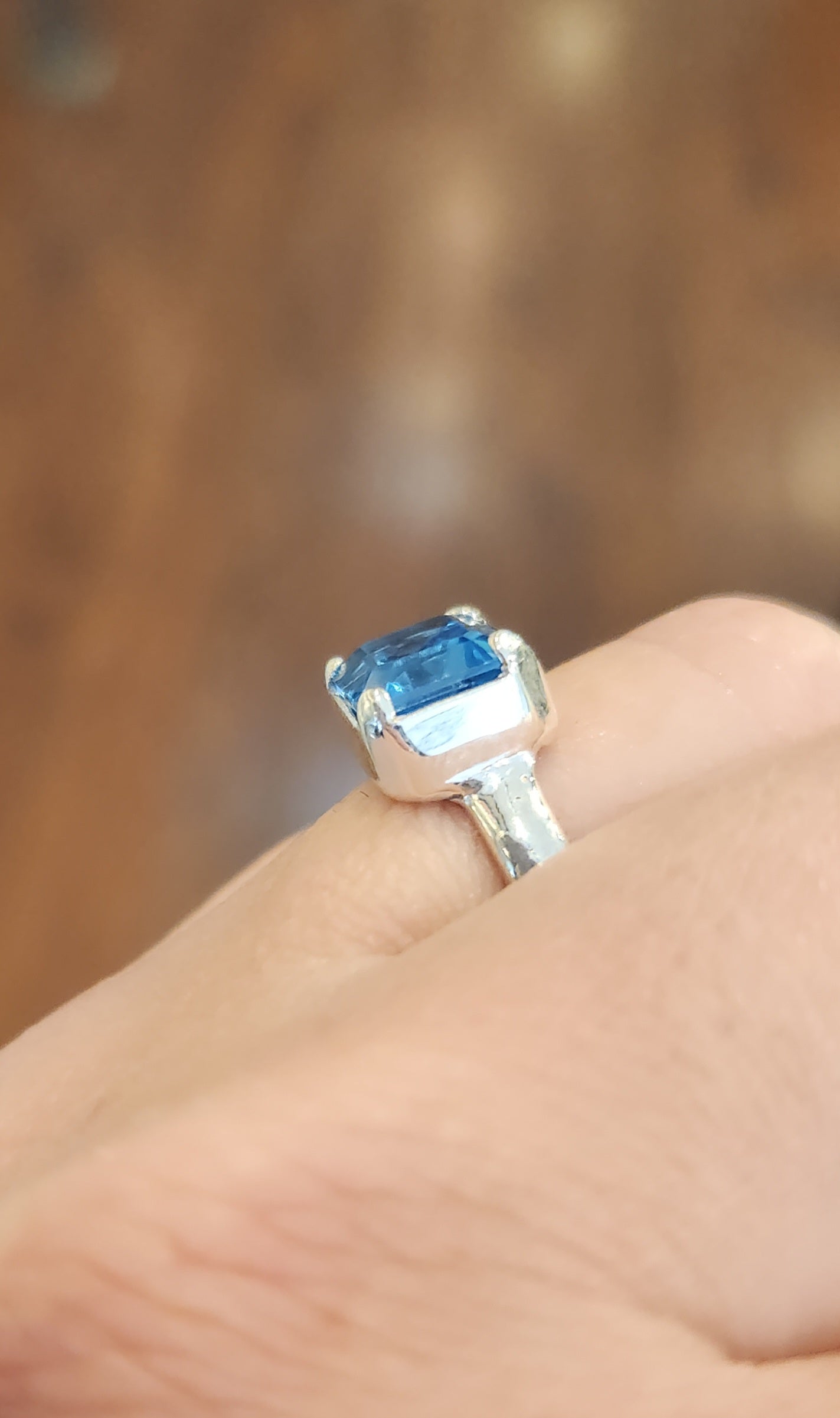 Sterling silver blue topaz bezel-prong ring