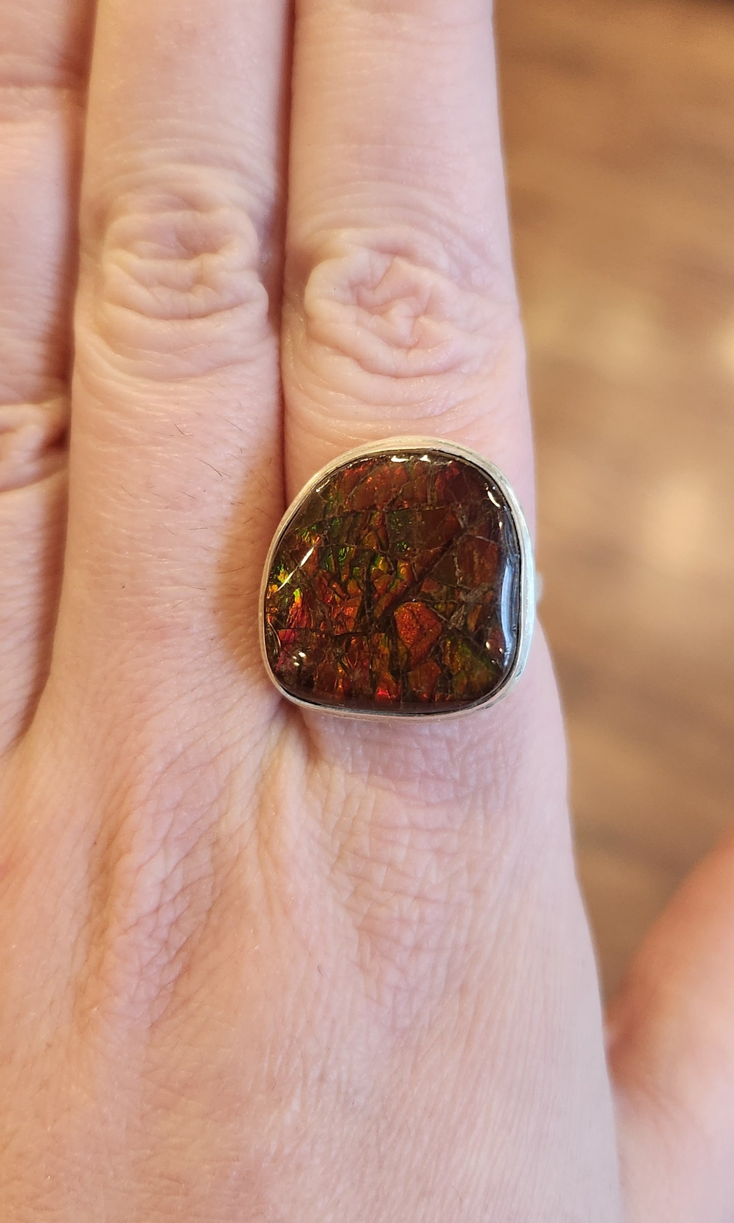 Sterling silver ammolite ring with orange/green flash