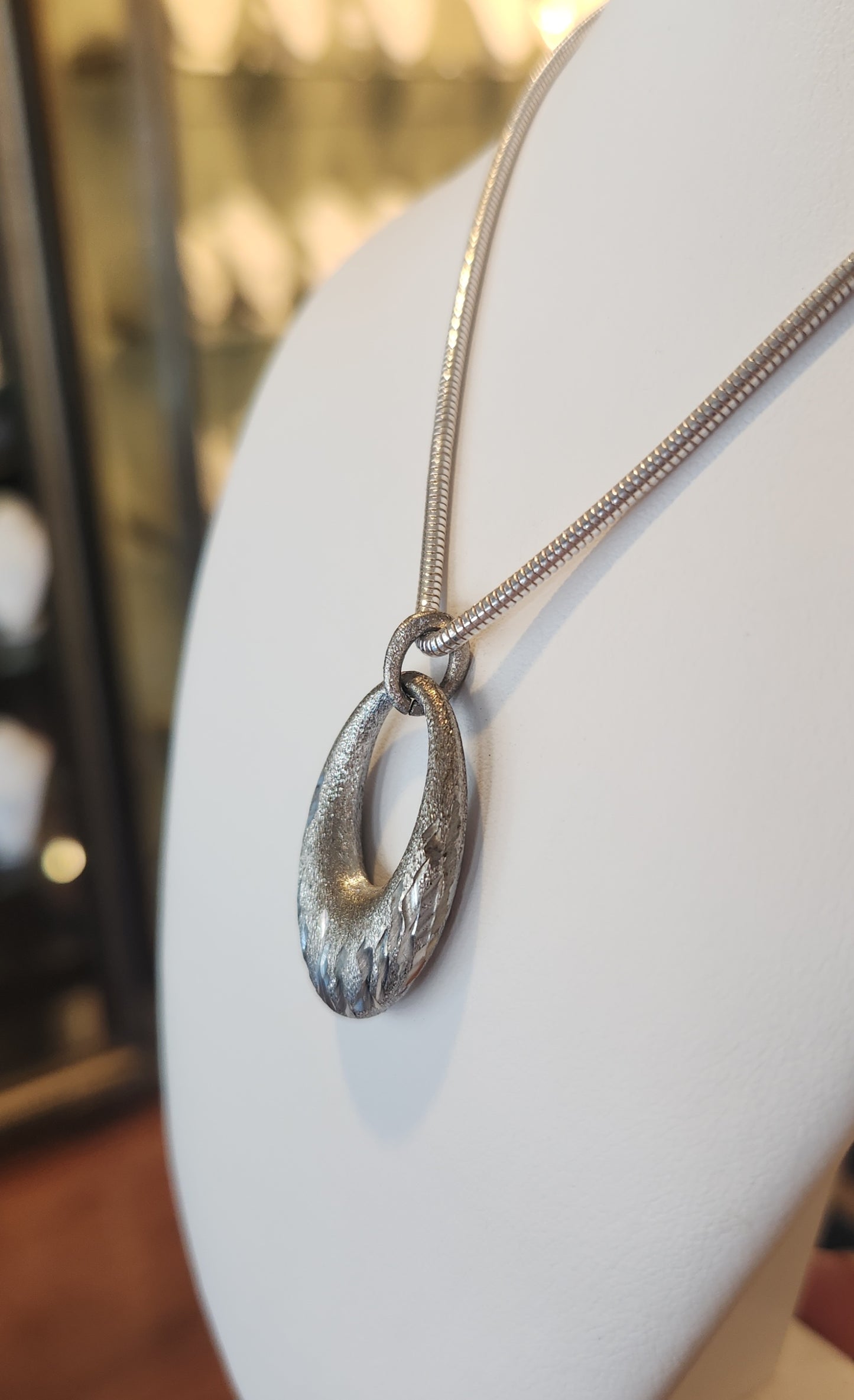 Sterling silver oval textured pendant