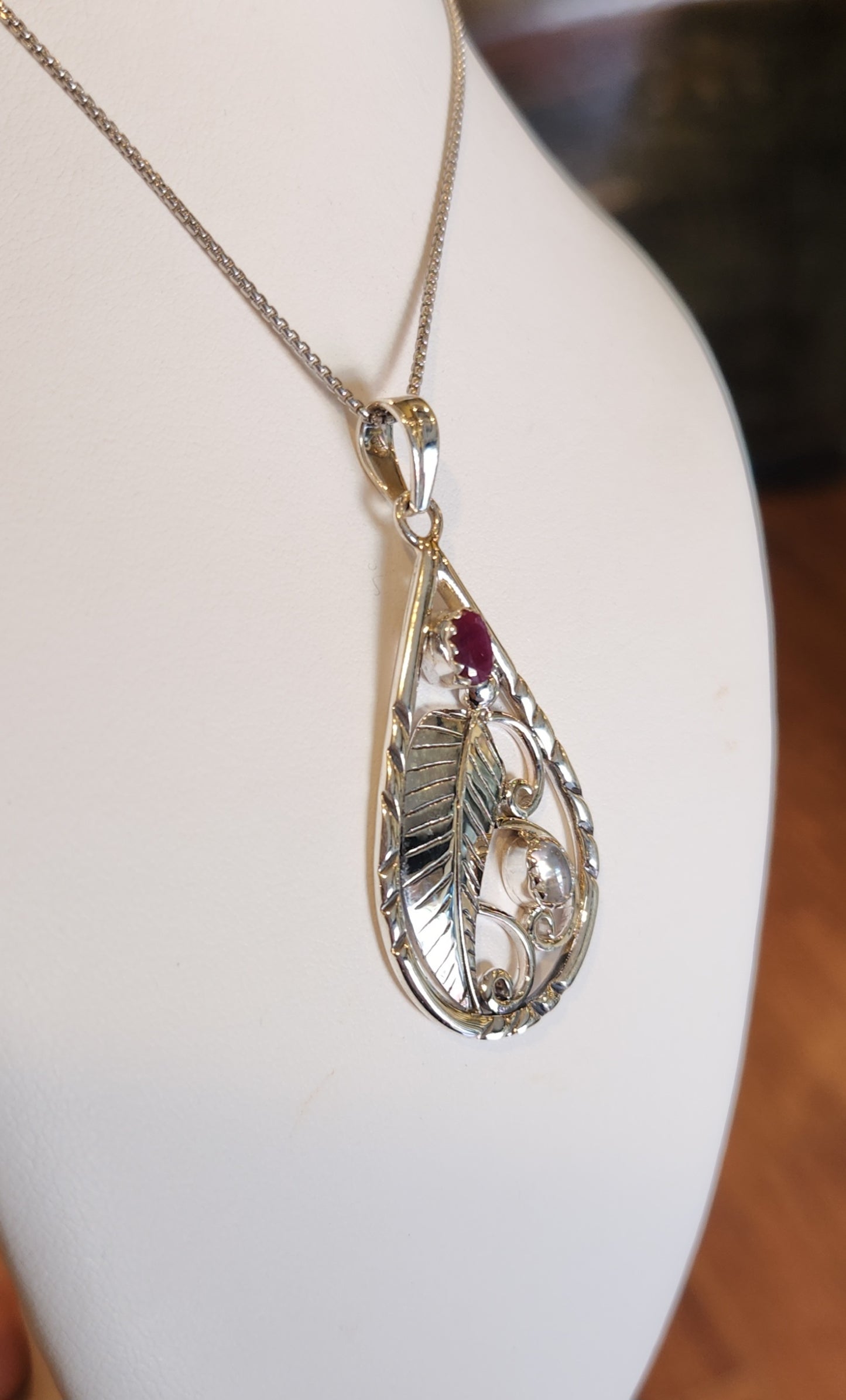 Sterling silver leaf pendant with ruby and rainbow moonstone