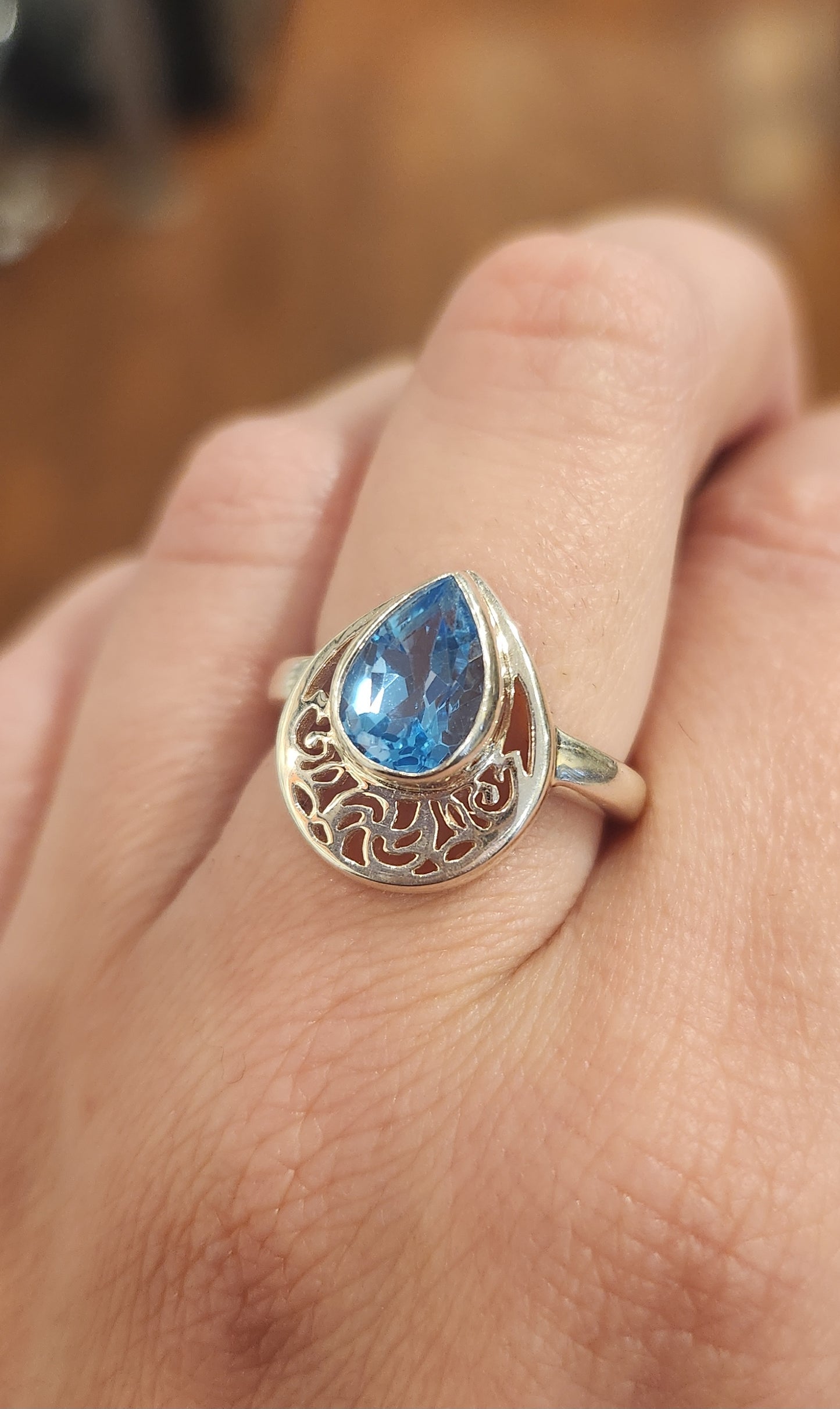 Sterling silver pear-shaped blue topaz filigree ring