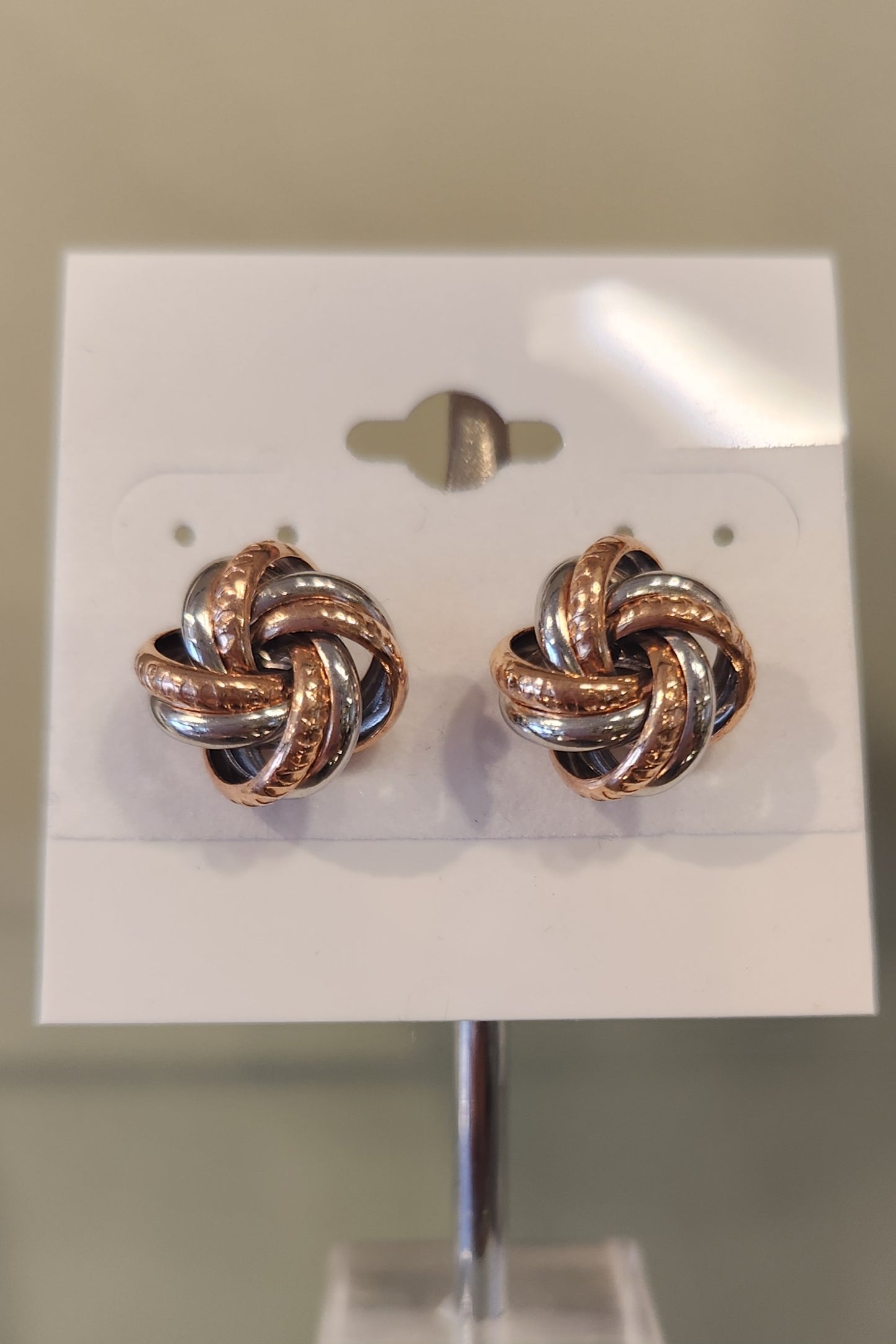 Sterling silver two-toned twisted knot stud earrings