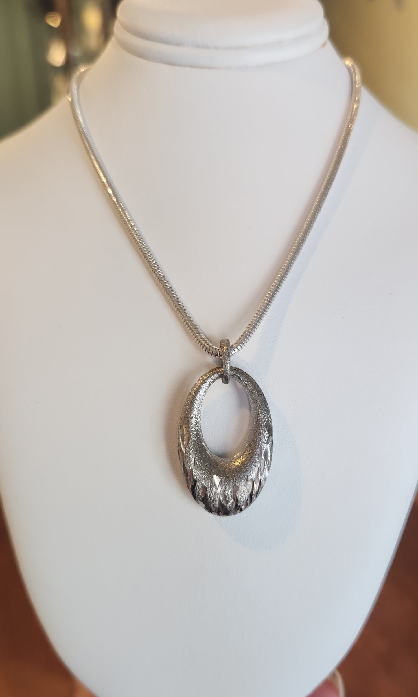 Sterling silver oval textured pendant