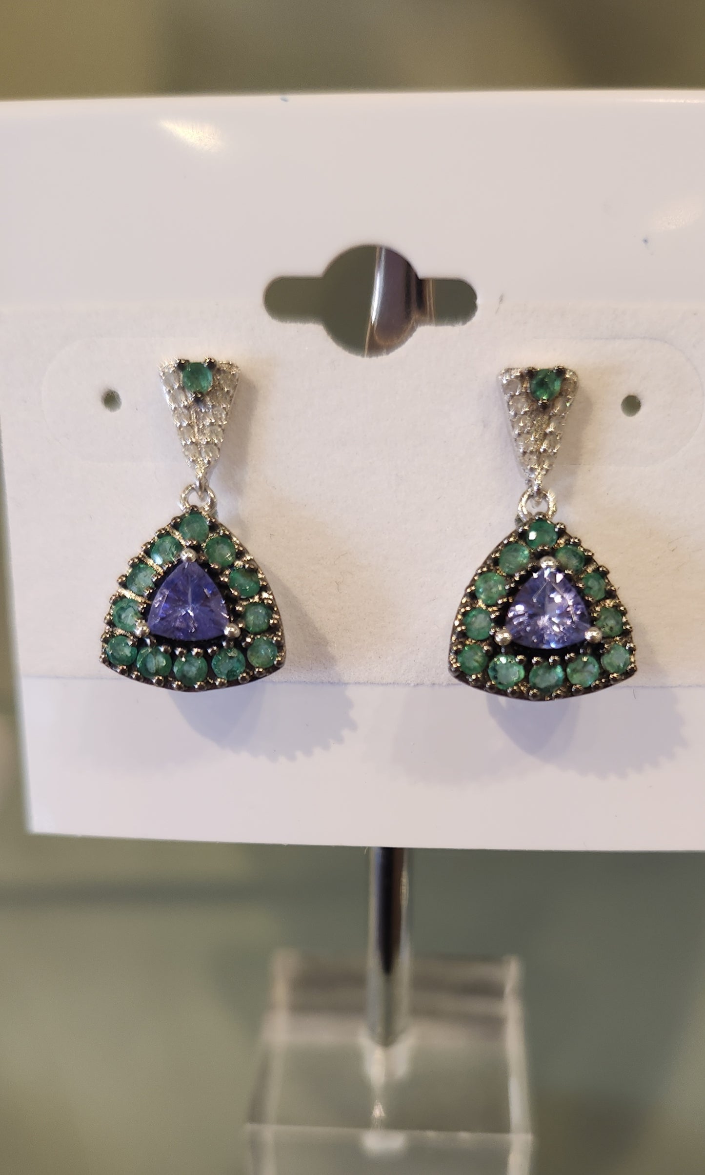 Sterling silver tanzanite dangle earrings with emeralds