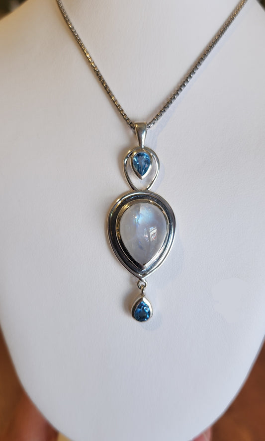 Sterling silver rainbow moonstone pendant with blue topaz