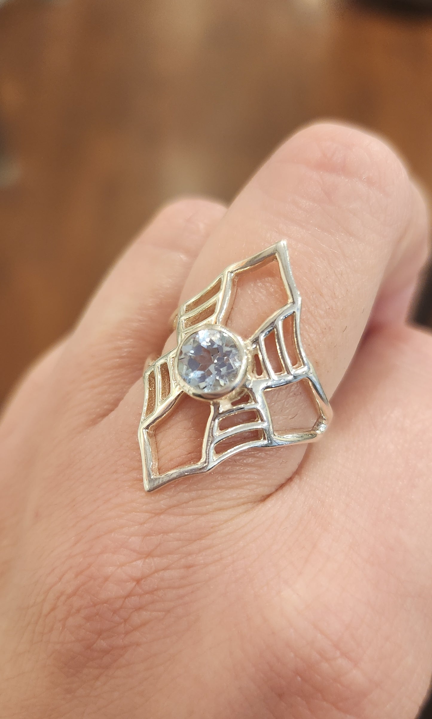 Sterling silver blue topaz spider-web ring