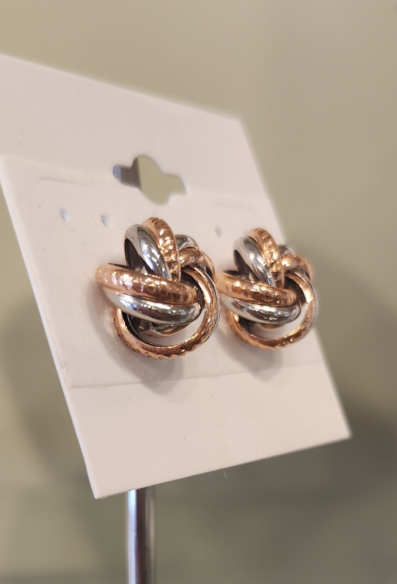 Sterling silver two-toned twisted knot stud earrings