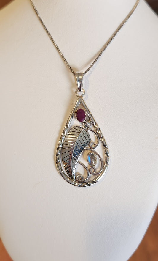 Sterling silver leaf pendant with ruby and rainbow moonstone