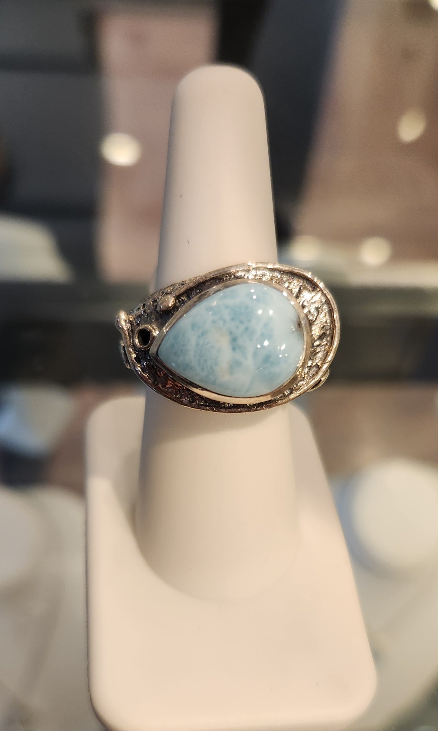 Sterling silver ring with sideways pear-shaped larimar cabochon